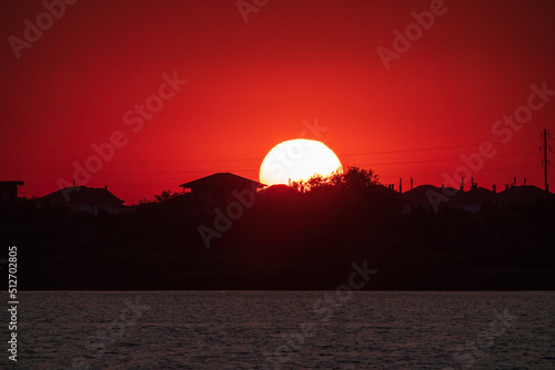 The sun goes down over a lake