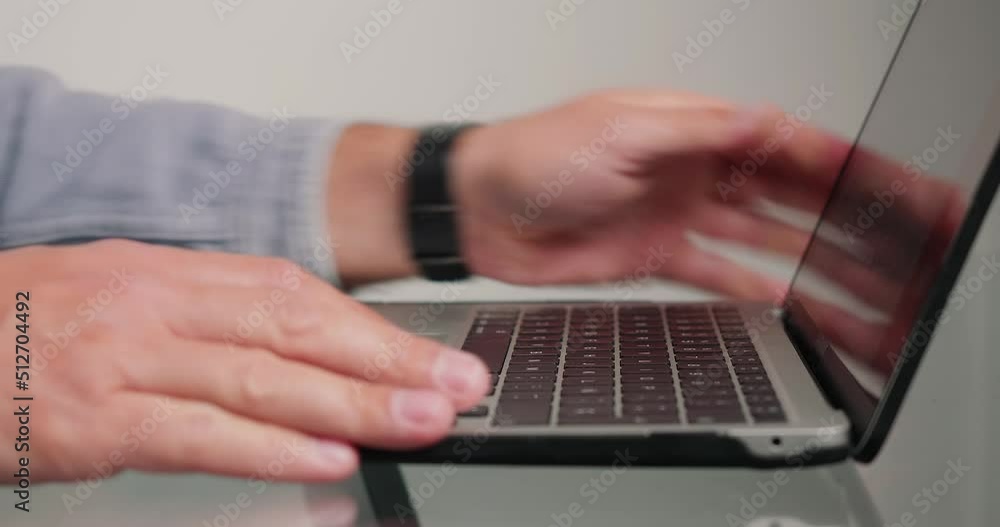 Freelancer puts laptop at desk and opens to send project Freelancer puts laptop at desk and opens to send project