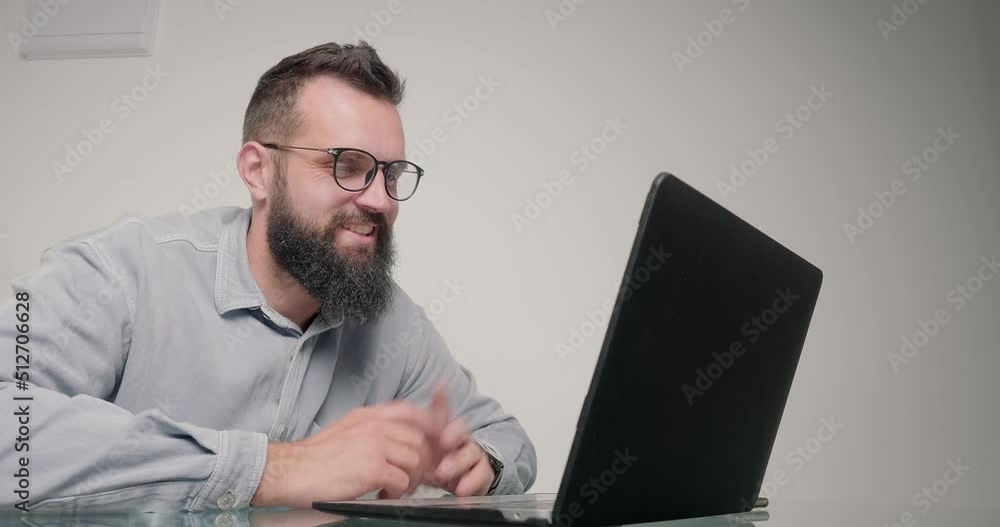 Employee talks to colleague on video call via laptop Employee talks to colleague on video call via laptop