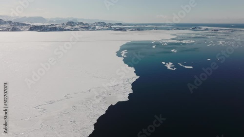 Drone Flight Over Sea And Icy Coastline By Sissiiut photo