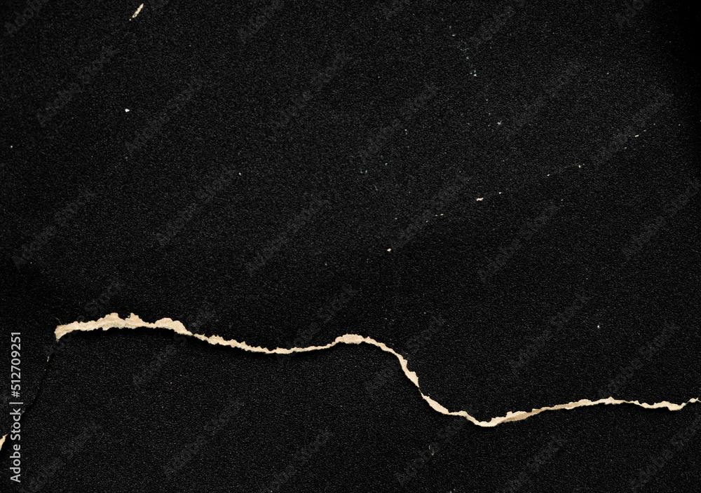 Crumpled black paper with a detailed texture. Close up the paper with