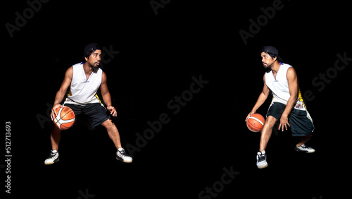 Gesture of Asian basketball player dribbling on black background. Basketball concept in Asia