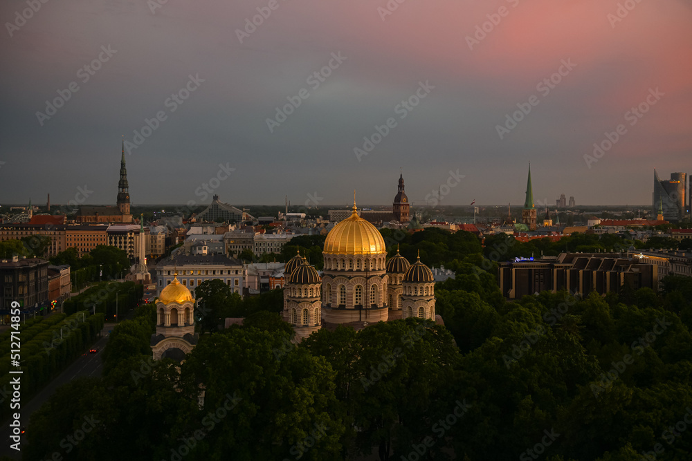 Beautiful summer sunset over the central district of Riga, with view to Freedom Monument, Old town and Cathedral. Landmarks of Latvia.