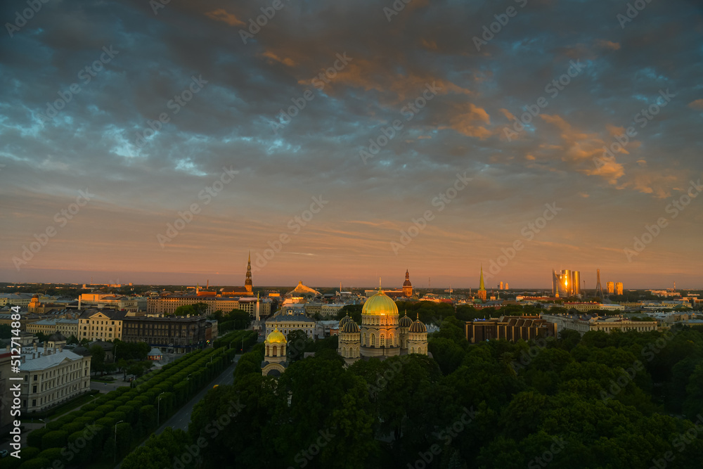 Amazing summer sunrise over the central district of Riga, with view to Freedom Monument, Old town and Cathedral. Landmarks of Latvia.