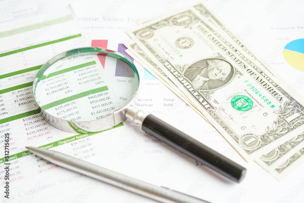 Magnifying glass on US dollar and EURO banknotes and graph, finance business trade concept. Magnifying glass on US dollar and EURO banknotes and graph, finance business trade concept.