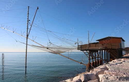 wooden house and fishermens nets in the infrastructure called TRABUCCO in Italian language the Adriatic sea in Europe photo