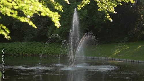 Wallpaper Mural 4k video Beautiful water fountain in a luxury backyard garden in sunset light Torontodigital.ca