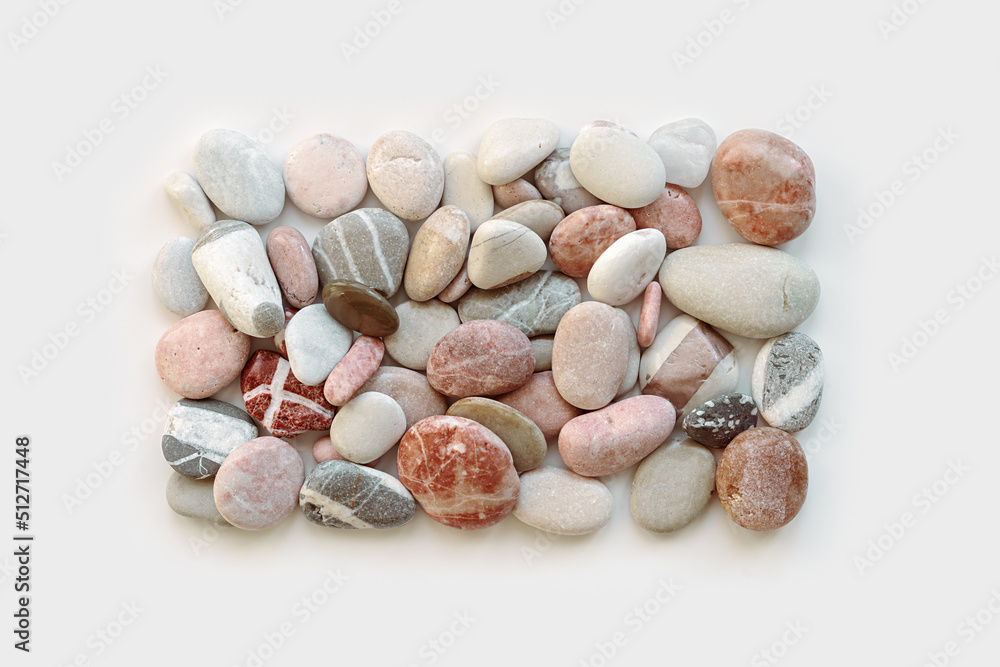 Top view close up pebbles sea stones on light background. Square composition from natural stone natural colors. Minimal style flat lay, concept of calm, peace, meditation. summer pattern. Top view close up pebbles sea stones on light background. Square composition from natural stone natural colors. Minimal style flat lay, concept of calm, peace, meditation. summer pattern.