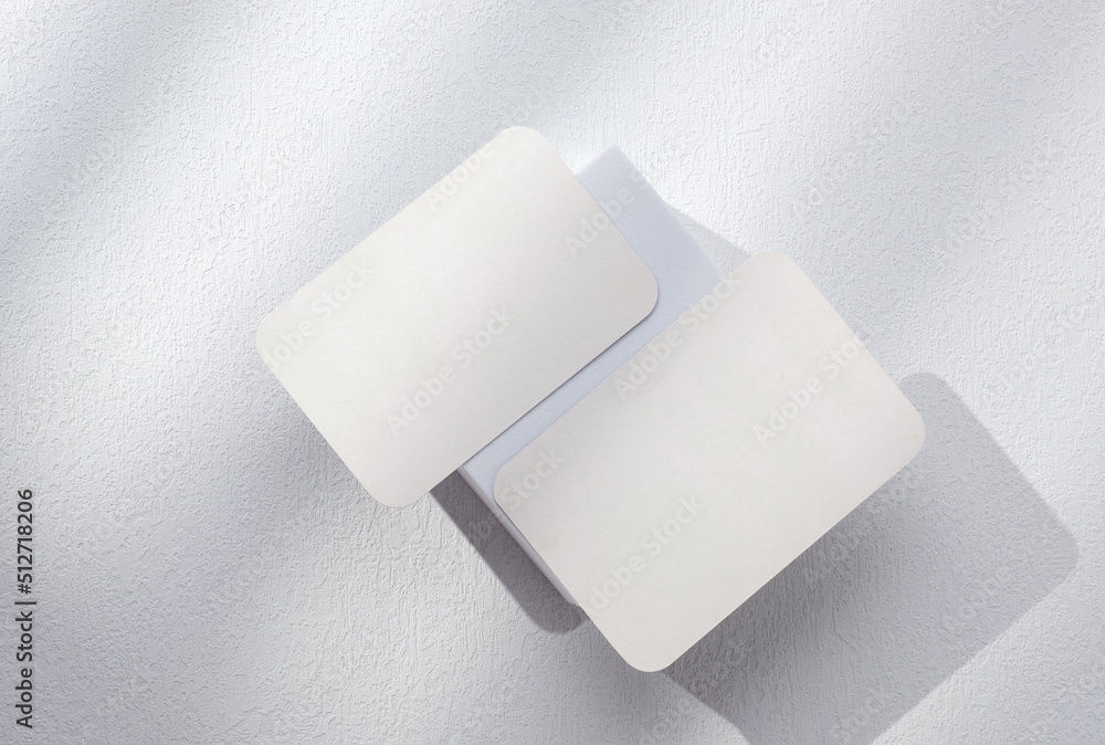 mockup blank busienss card on white block with sunlight mockup blank busienss card on white block with sunlight