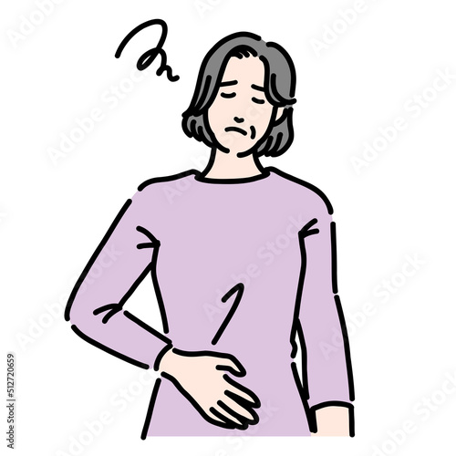 お腹の調子が悪く不調そうなシニア女性