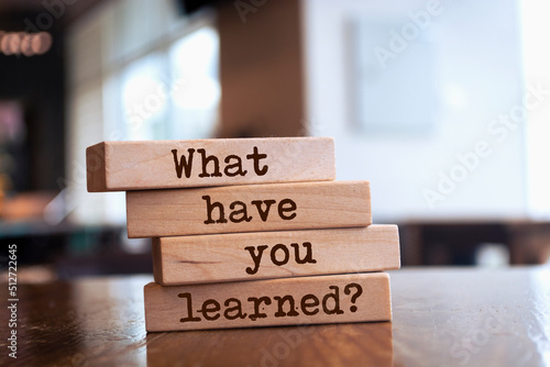 Wooden blocks with words 'What have you learned?'.