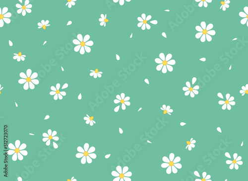 Daisies and petals on a green background seamless pattern. Chamomile flowers. Vector background. 