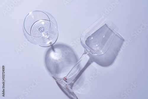 Two empty wine glass on gray background top view