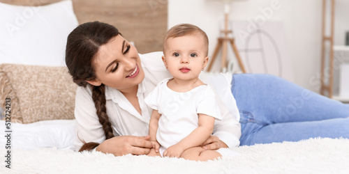 Happy mother with cute litt...