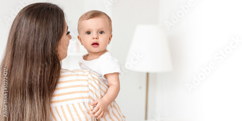 Happy mother with cute litt...