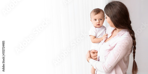 Happy mother with cute litt...