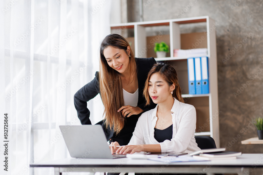 Cropped shot of Asian Business woman diverse coworkers working together in the boardroom, brainstorming, discussing, and analyzing business report strategy collaboration. Cropped shot of Asian Business woman diverse coworkers working together in the boardroom, brainstorming, discussing, and analyzing business report strategy collaboration.