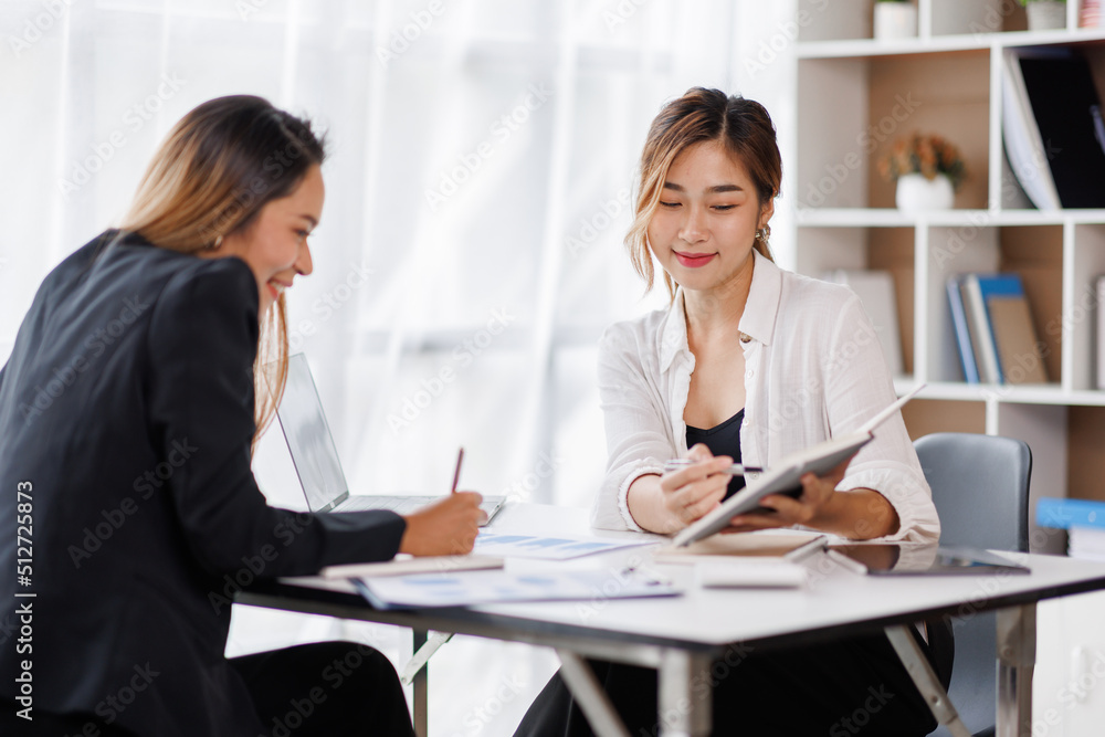 Cropped shot of Asian Business woman diverse coworkers working together in the boardroom, brainstorming, discussing, and analyzing business report strategy collaboration. Cropped shot of Asian Business woman diverse coworkers working together in the boardroom, brainstorming, discussing, and analyzing business report strategy collaboration.