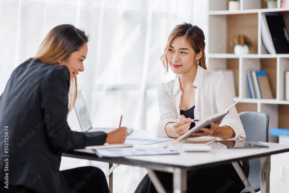 Cropped shot of Asian Business woman diverse coworkers working together in the boardroom, brainstorming, discussing, and analyzing business report strategy collaboration.