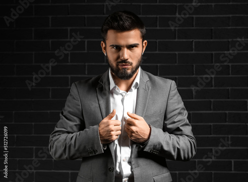 Bearded businessman wearing...