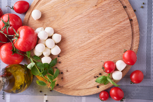 Ingredients for Caprese salad - Mini mozzarella cheese in glass bowl  tomato and basil