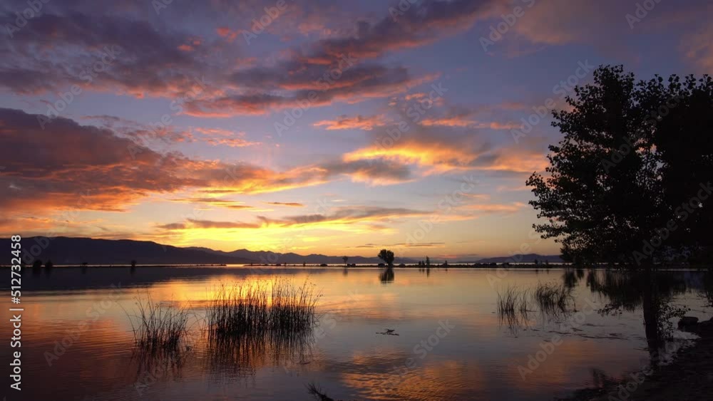 View of colorful sunset reflecting at lake in Utah at Provo Boat Harbor. View of colorful sunset reflecting at lake in Utah at Provo Boat Harbor.