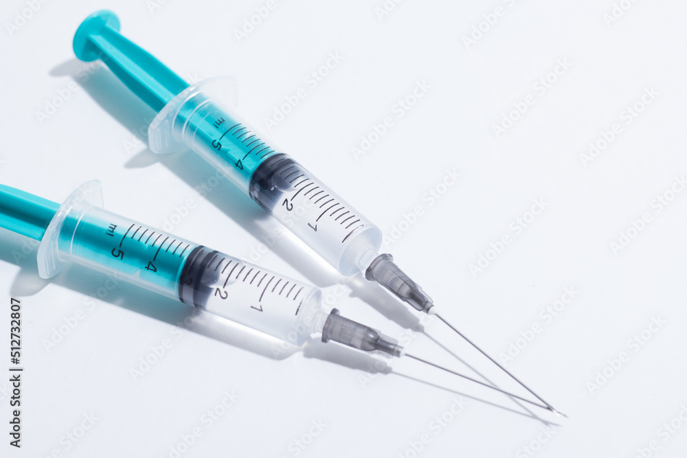 Disposable plastic syringe prepared for injection and vaccination in the hospital. The concept of medicine and health Disposable plastic syringe prepared for injection and vaccination in the hospital. The concept of medicine and health