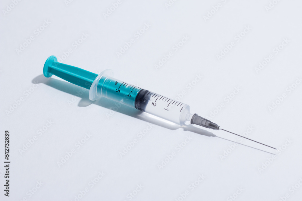 Disposable plastic syringe prepared for injection and vaccination in the hospital. The concept of medicine and health Disposable plastic syringe prepared for injection and vaccination in the hospital. The concept of medicine and health