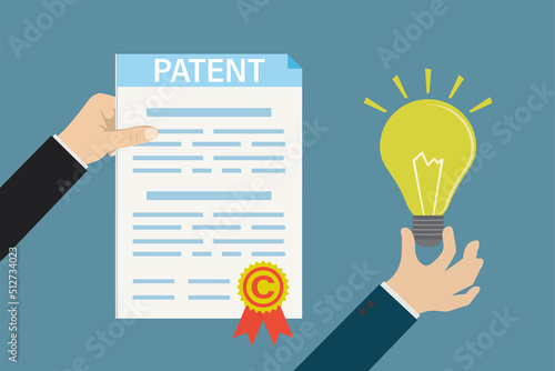 Bureau clerk grants patent for new idea. Intellectual property paper document. Patent protection, copyright reserved or product trademark that cannot copy. Protect business ideas. photo