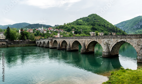 The Ottoman Mehmed Pasa Sokolovic Bridge in Visegrad, Bosnian mountains, reflected in the river Drina, Bosnia and Herzegovina. © Ivan