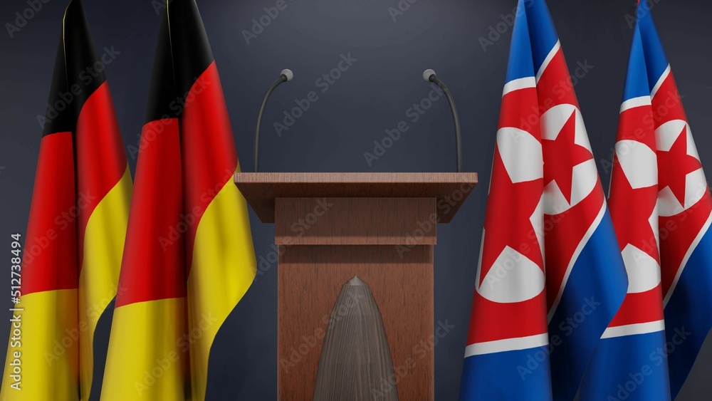 Flags of Germany and North Korea at international meeting or negotiations press conference. Podium speaker tribune with flags and coat arms. 3d rendering