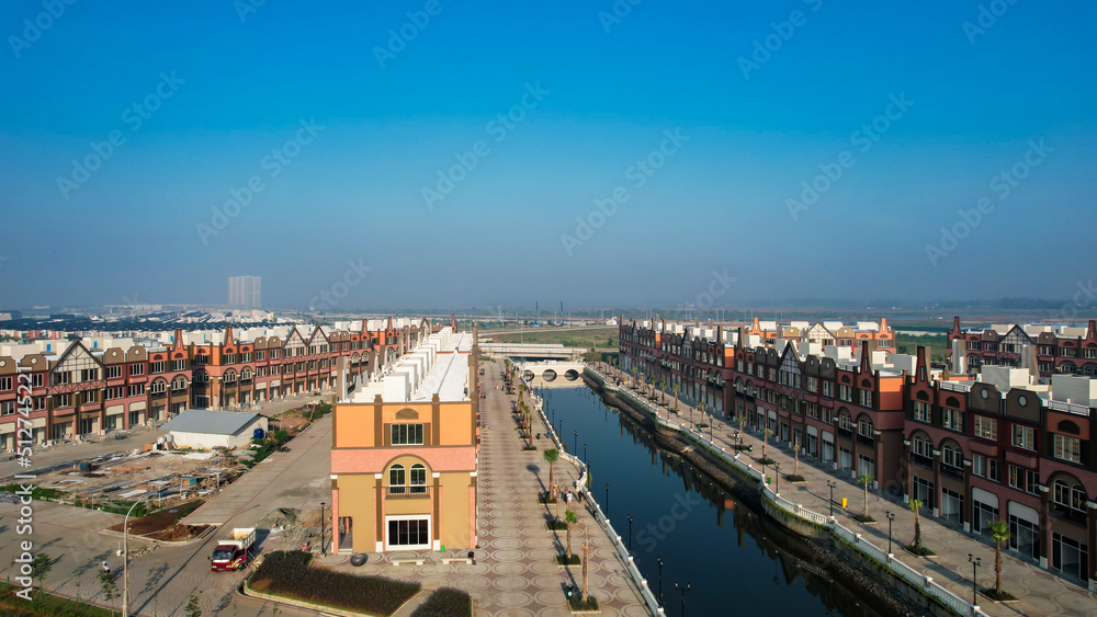 Aerial view of Amsterdam Dutch dancing houses above the southeast of the jakarta river in the spring landscape of the old European city at Pantai Indah Kapuk. 