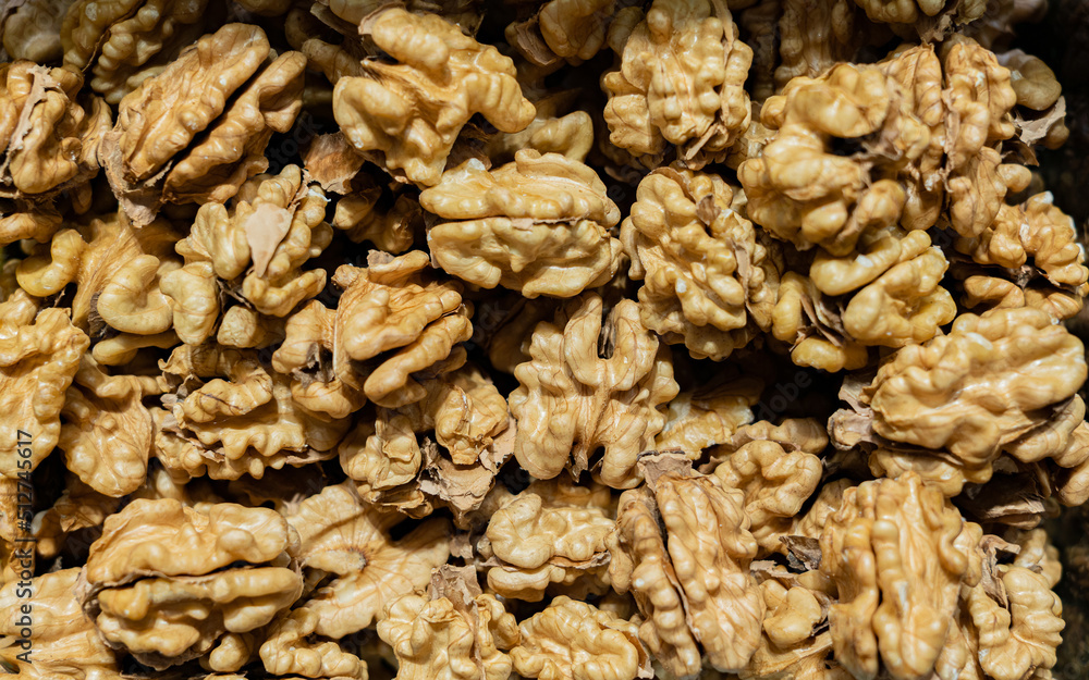 Peeled walnut grains close up for background Peeled walnut grains close up for background