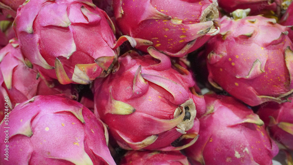 Stack of fresh dragon fruit for sale in a farmers market Stack of fresh dragon fruit for sale in a farmers market