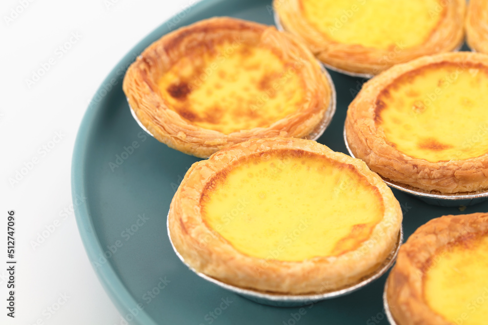 Baked fresh egg tarts on plate Baked fresh egg tarts on plate