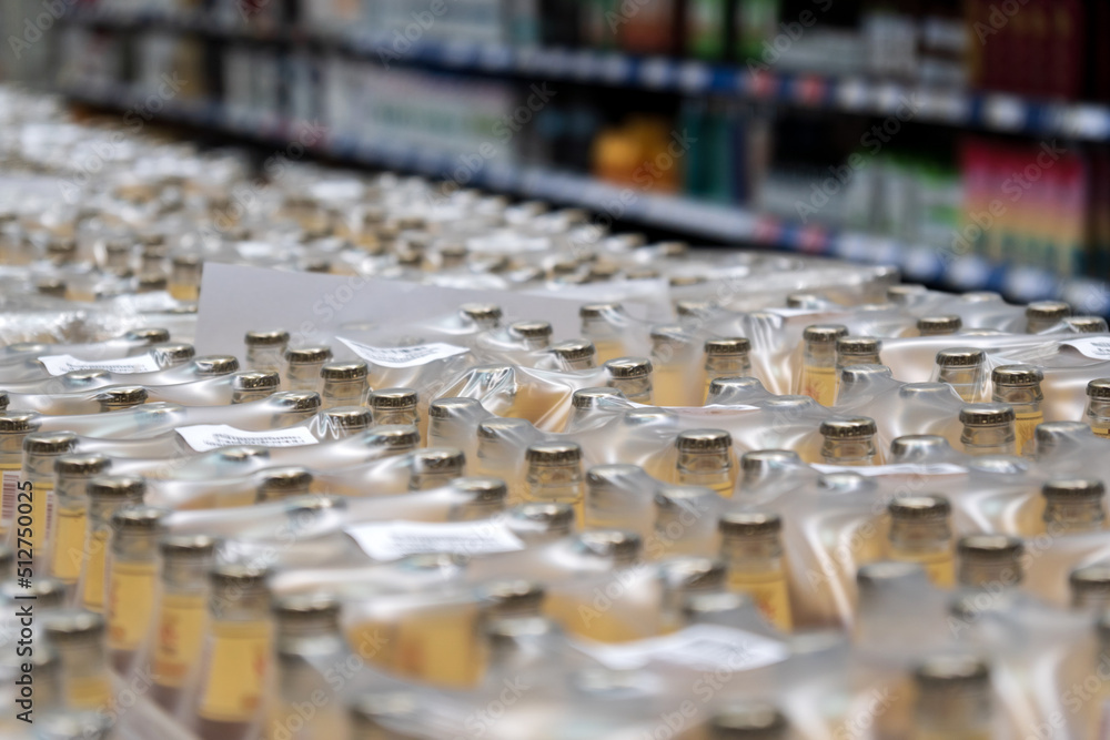 Fototapeta premium Various alcohol beer packaging boxes that wholesaling on a liquor zone in a supermarket. Selective focus