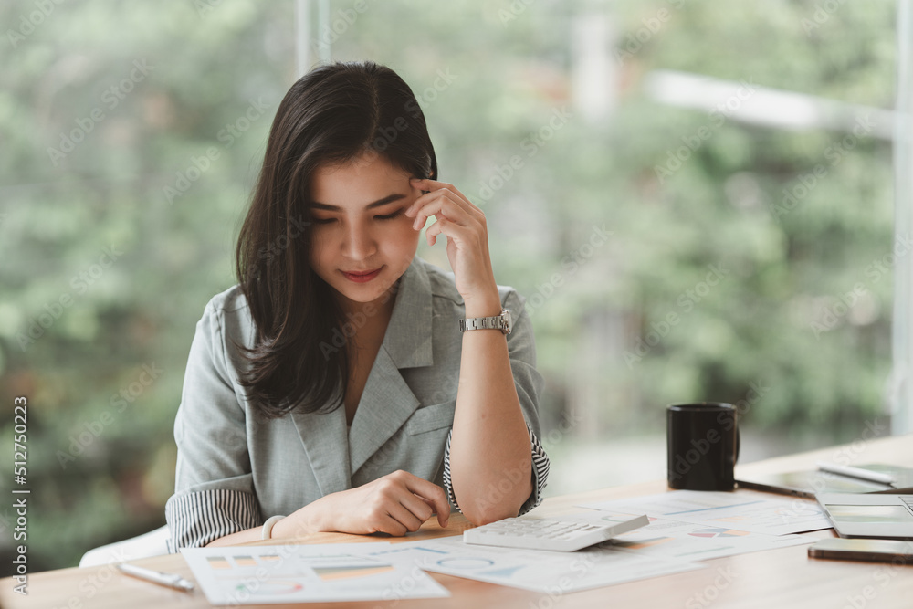 Business Finance audit tax Concept. Portrait of Asian business woman worry about marketing plan of this years. Business Finance audit tax Concept. Portrait of Asian business woman worry about marketing plan of this years.