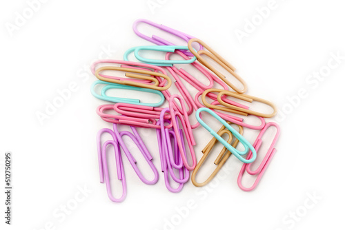 Multicolored paper clips close up isolated on white background. Stationery concept.