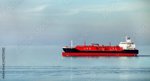 Side view oil and gas petrochemical tanker offshore in opensea, Refinery industry cargo ship, Oil product tanker and LPG tanker at sea view from above, Aerial view oil tanker ship vessel. photo
