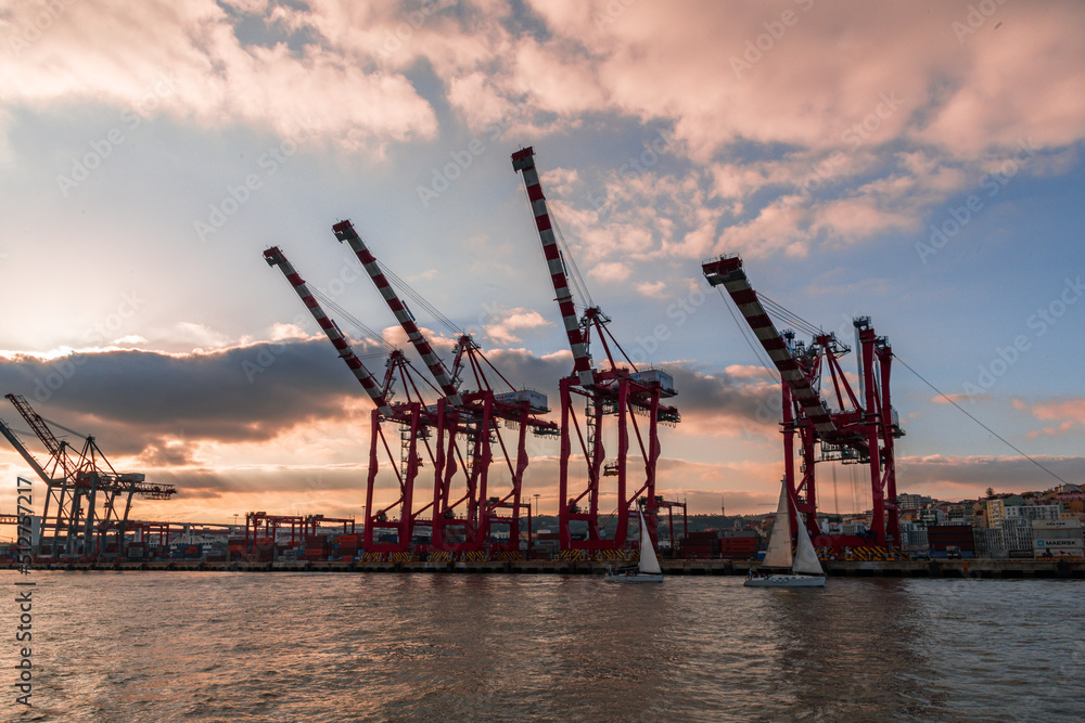 Container cranes at the Lisbon harbour at sunset Container cranes at the Lisbon harbour at sunset