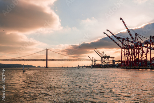 Container cranes at the Lisbon harbour at sunset