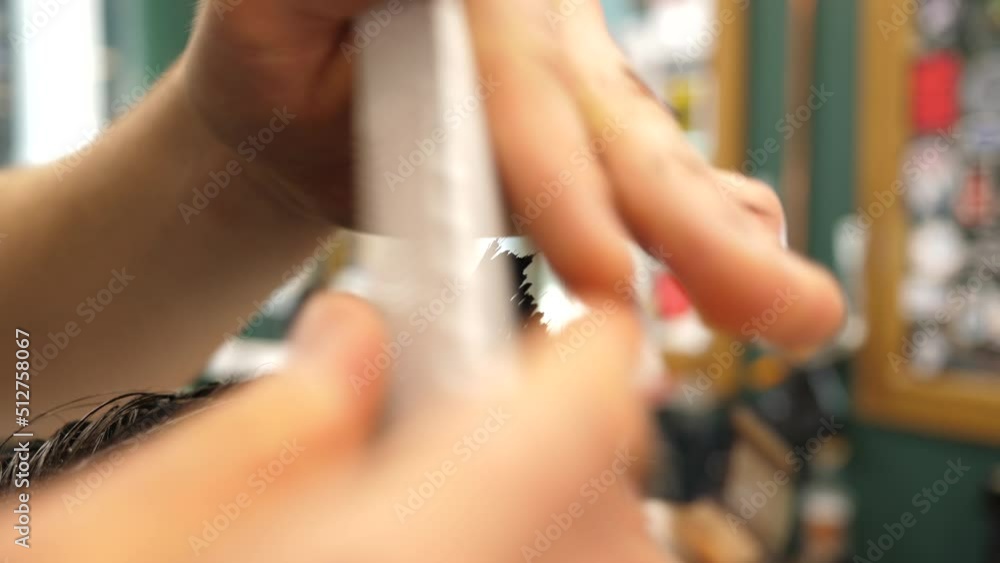 Barbershop salon working process closeups barber working with client hair Barbershop salon working process closeups barber working with client hair