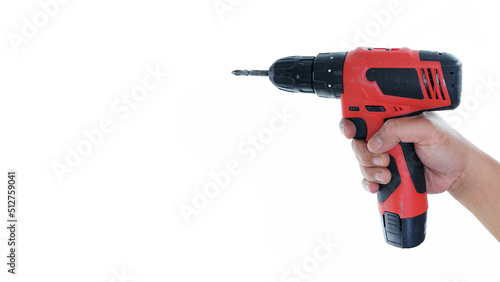 right hand holding red cordless drill isolated white background