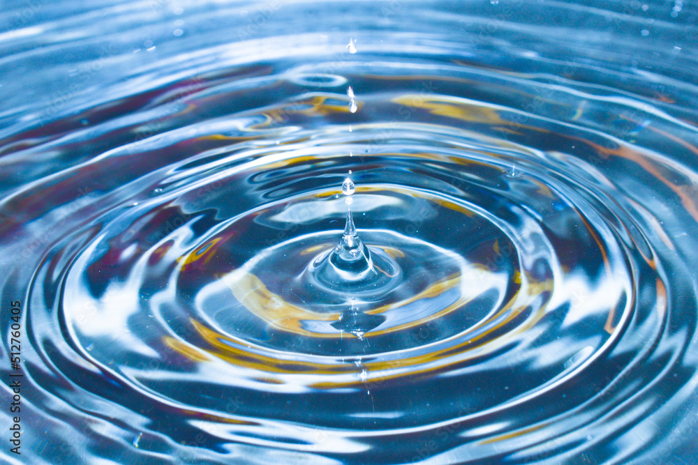 Drop of water drop to the surface, waves on the surface of the water a collision Drop of water drop to the surface, waves on the surface of the water a collision