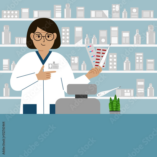 Pharmacist at the pharmacy behind the counter. A female pharmacist holds medicines in his hand.