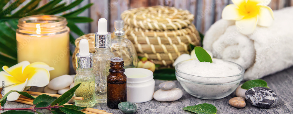 Background spa cosmetics and oils and herbs. Selective focus. Background spa cosmetics and oils and herbs. Selective focus.