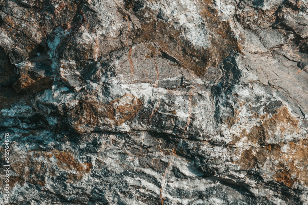 Gray stone texture background in grunge style. Mountain stones close up.
