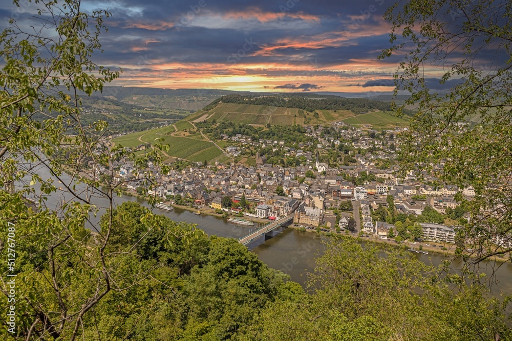 View of the Mosel river with the wine village of Traben-Trarbach in Rhineland-Palatinate at sunset