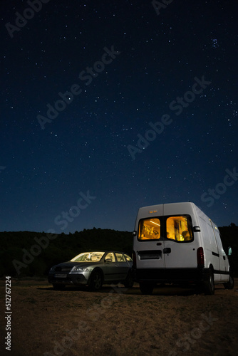 two car camping under stars