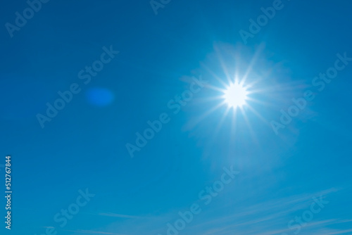 Beautiful shining sun,clear blue sky. Shining sun with A Lens Flare in The Deep Blue Sky, Natural and Environmental Image.Copy space.